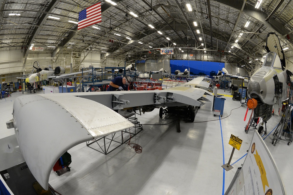 Mechanic working on the wing of an A-10 Thunderbolt II at Hill Air Force Base