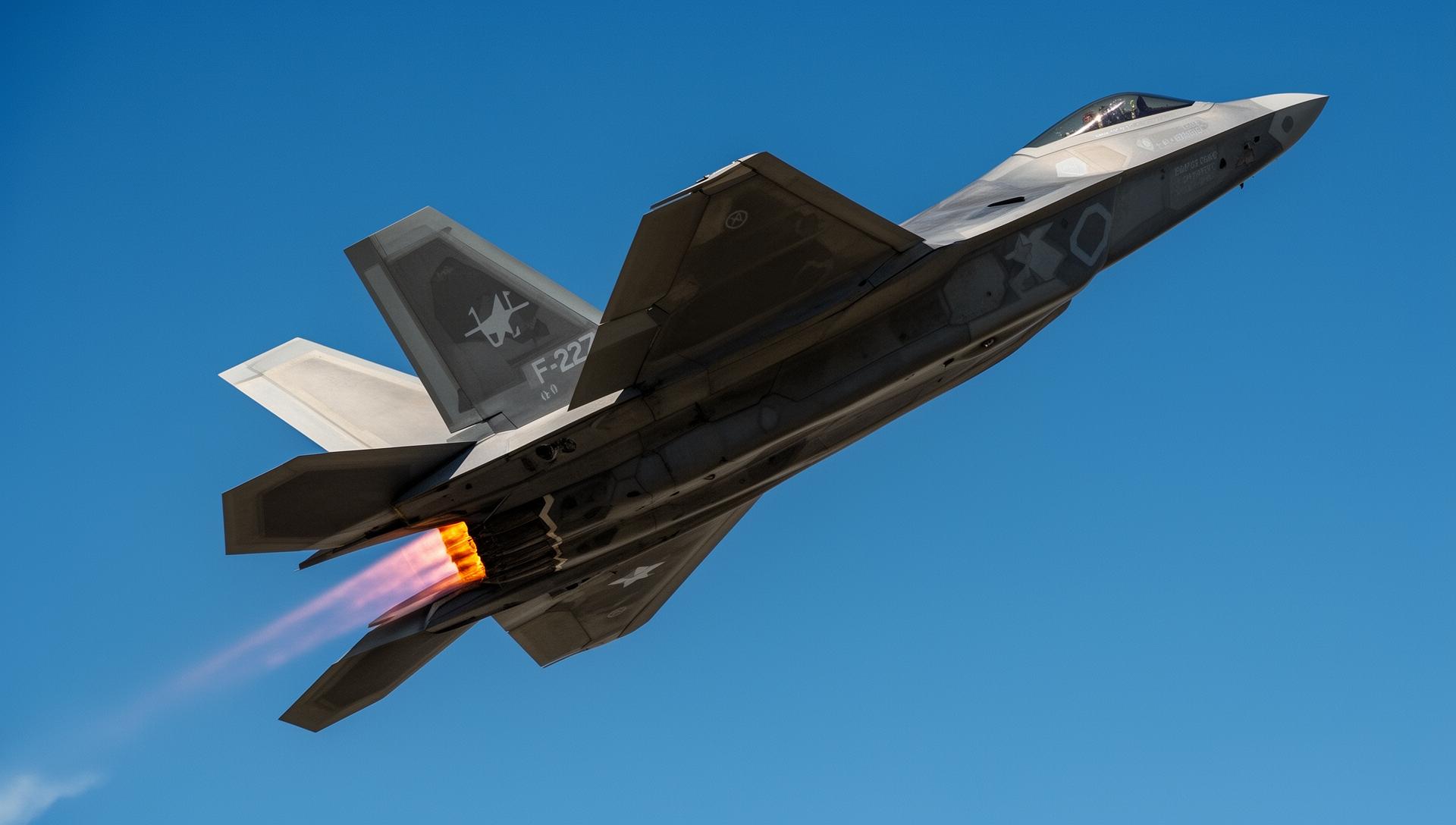 F-22 Raptor in a steep climb with afterburners