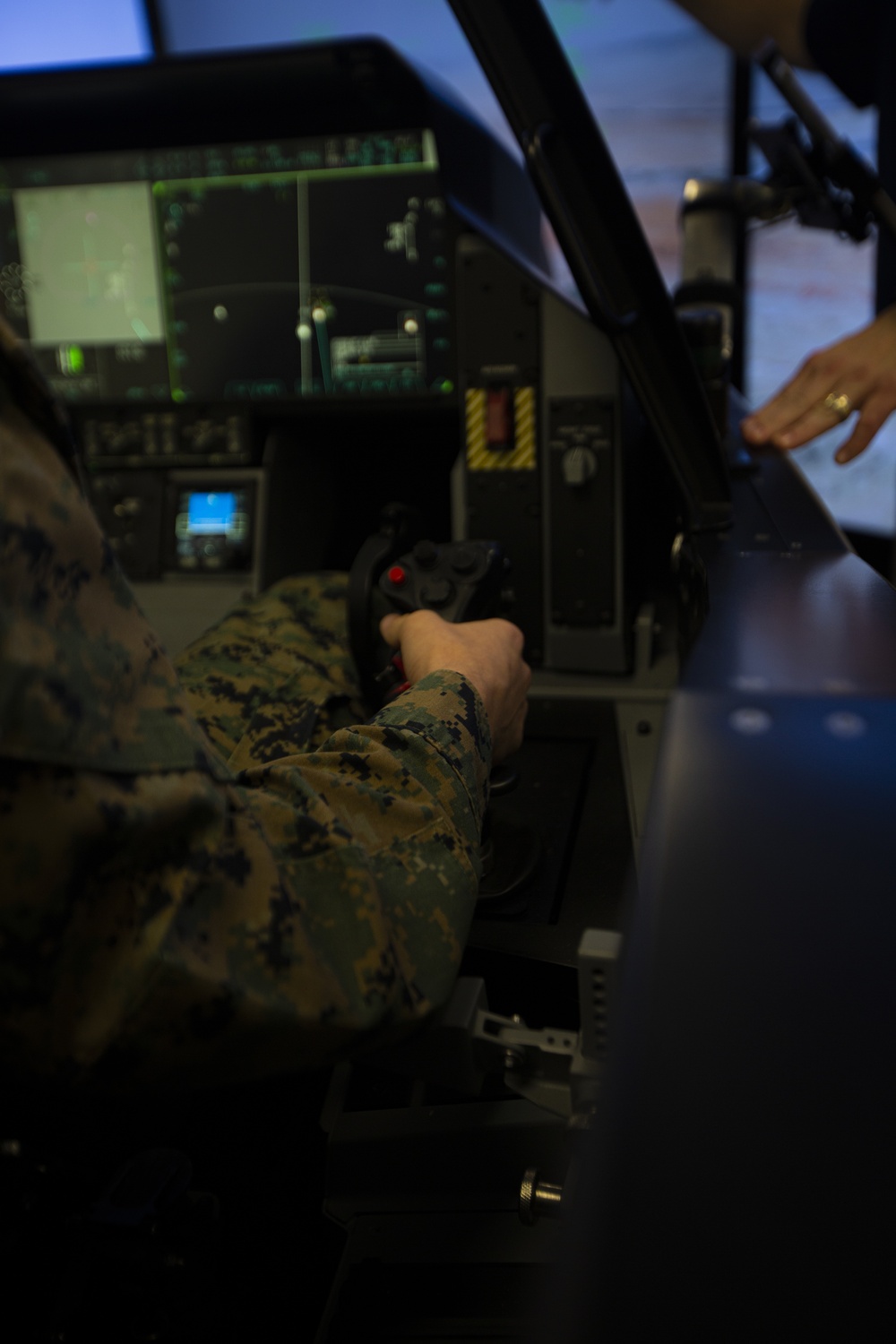 F-35 cockpit demonstrator showing advanced touchscreen displays and integrated avionics systems at III MEF