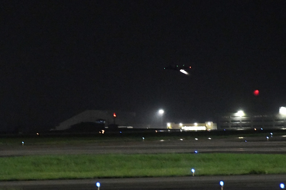 F-35 Lightning II conducts night flying operations with afterburner illuminating the aircraft against dark sky