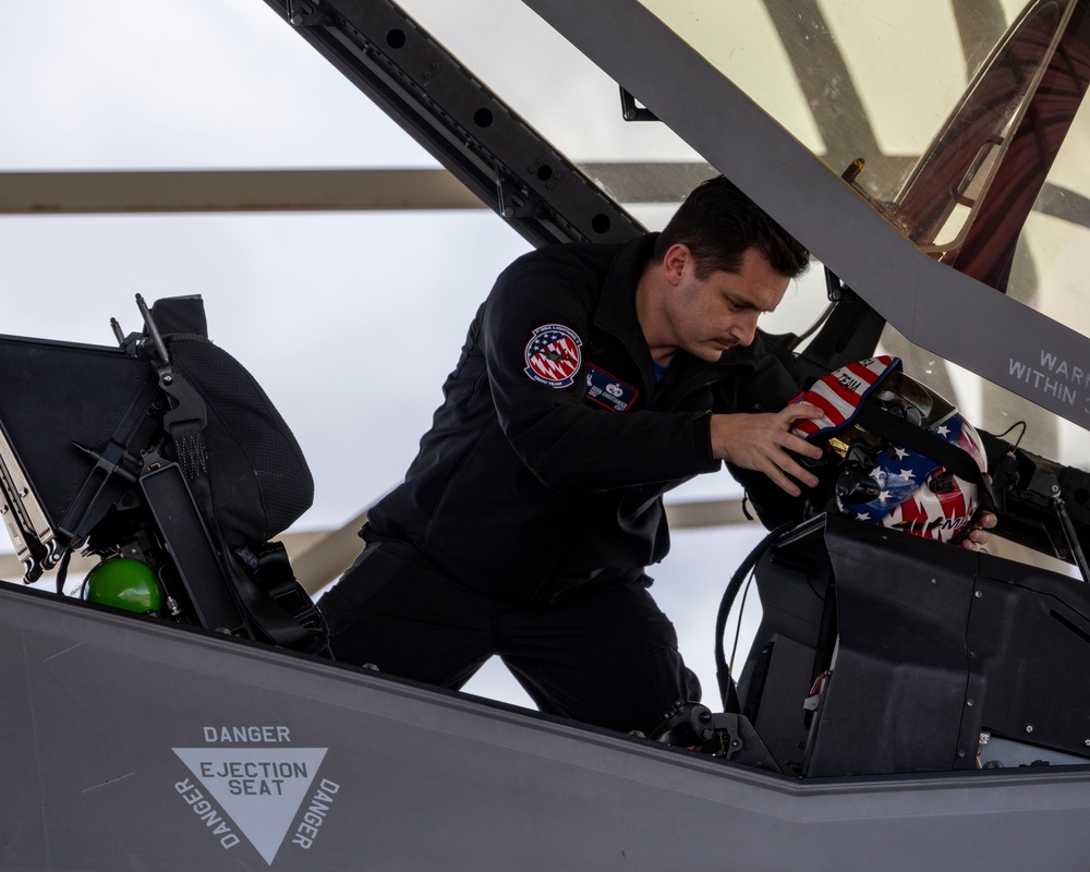 U.S. Air Force avionics specialist conducts pre-flight checks on F-35A Lightning II helmet and display systems