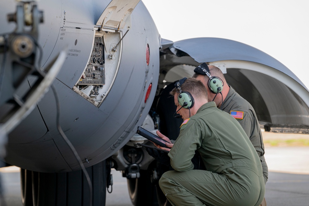 Airlift squadron members conducting specialized fueling operation