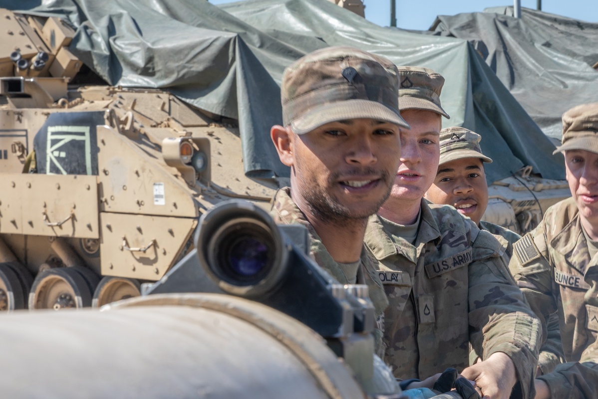 U.S. Army personnel conducting maintenance on M1 Abrams