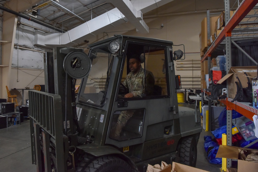 Military warehouse logistics operation showing supplies and equipment organization