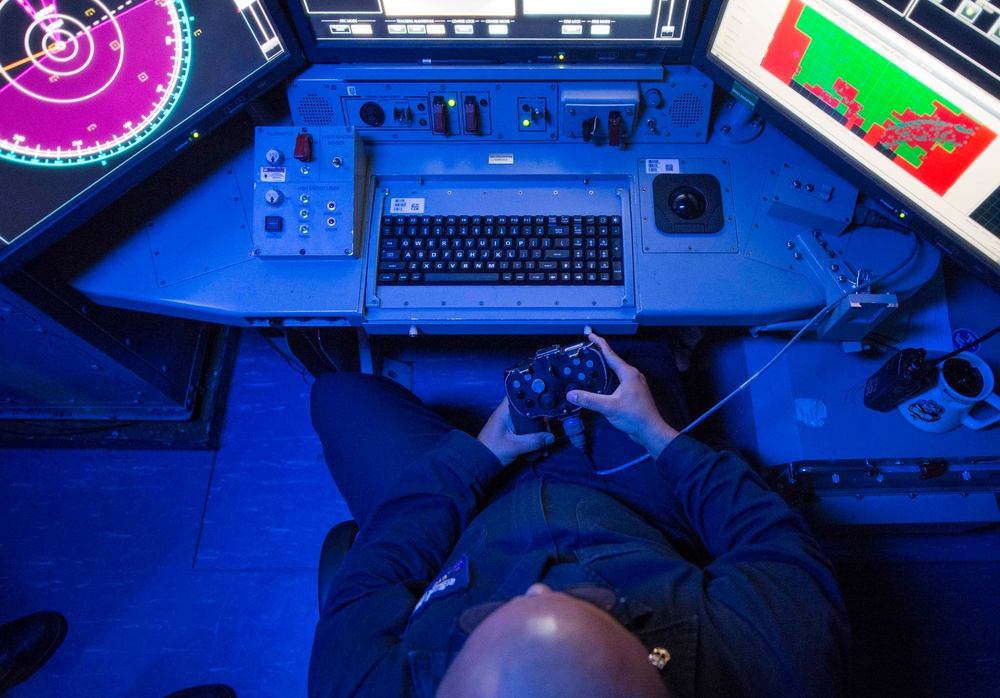 Chief Electronics Technician operating the Laser Weapon System console aboard USS Ponce