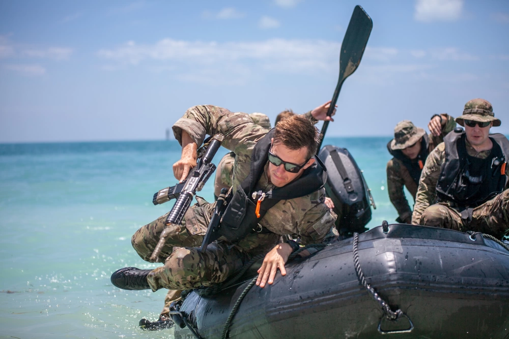 Soldiers attending the U.S. Army Special Forces Combat Diver Qualification Course practice amphibious infiltration in Key West, Florida, June 2018. U.S. Army photo by Robert Lindee.