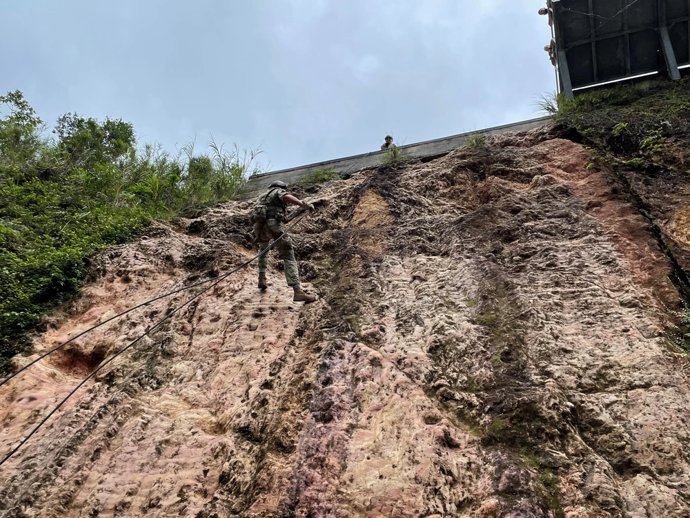Green Beret with 1st Special Forces Group rappels during Special Reconnaissance training at the Jungle Warfare Training Center in Okinawa, Japan, October 2021. U.S. Army courtesy photo.