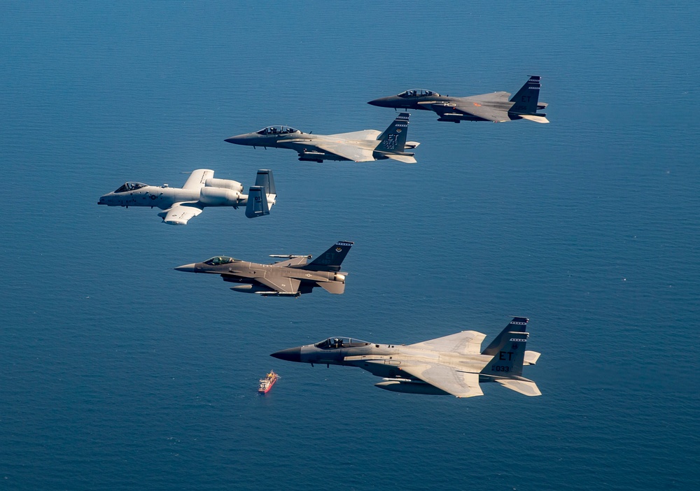 Formation of F-15, F-16, and A-10 fourth-generation fighter aircraft flying near Eglin Air Force Base