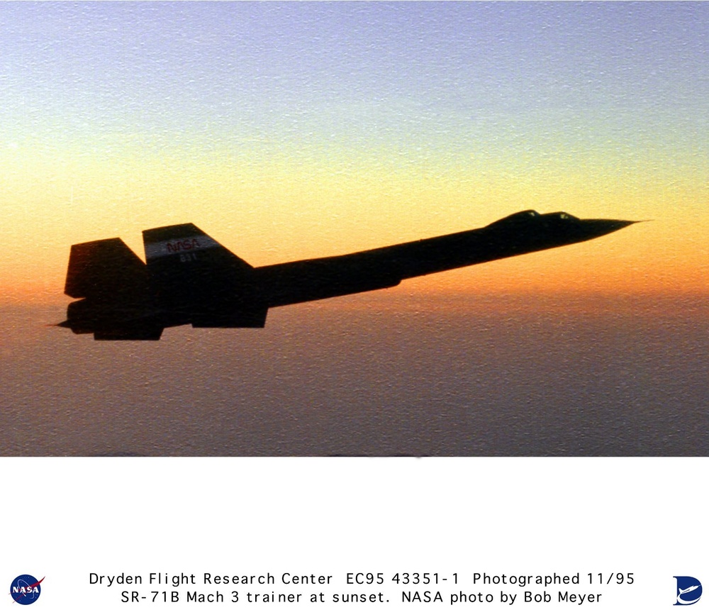 SR-71B Blackbird trainer aircraft flying at high altitude during sunset