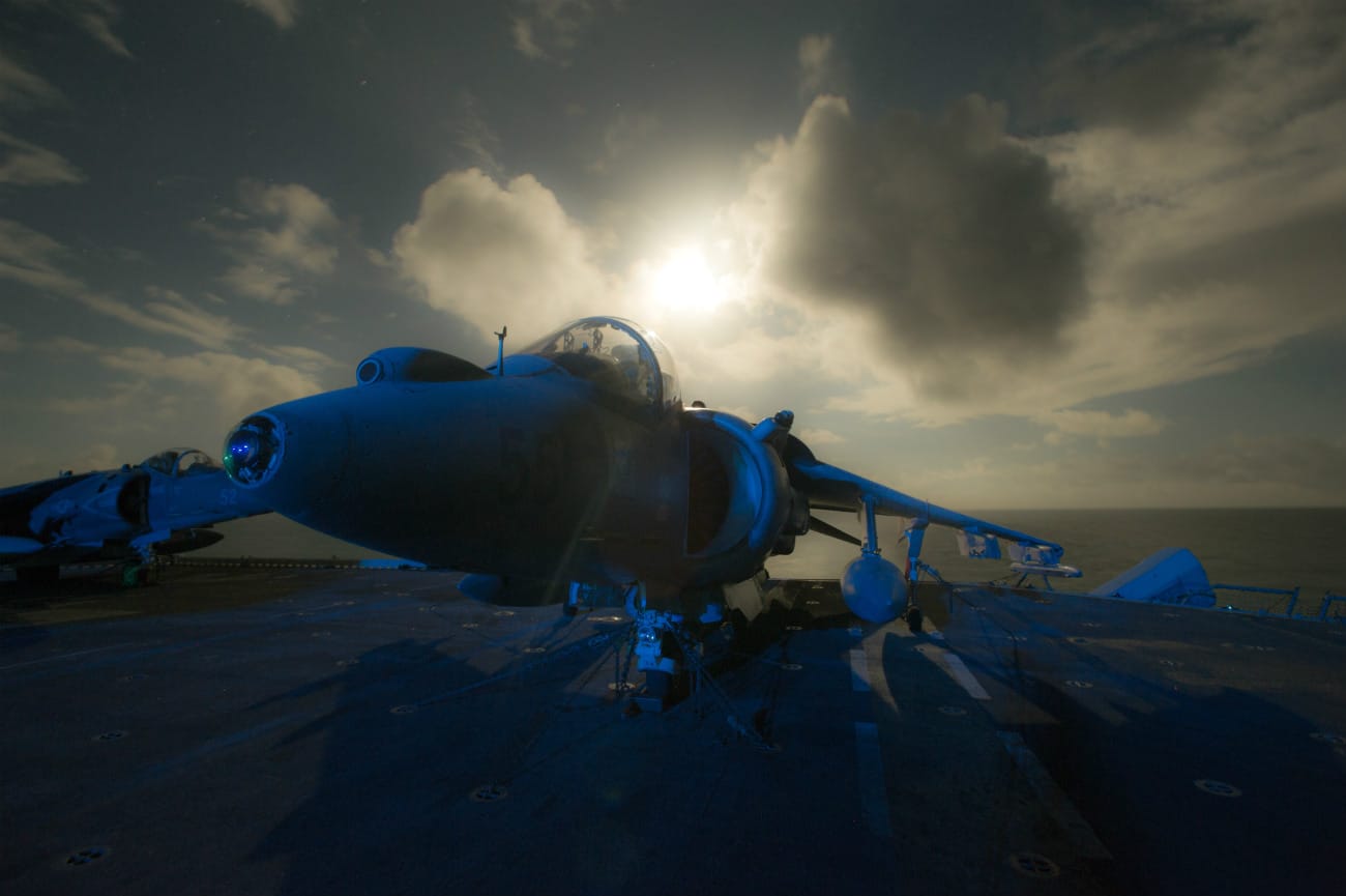 US Military Aircraft at Night Images - AV-8B Harrier II parked on flight deck