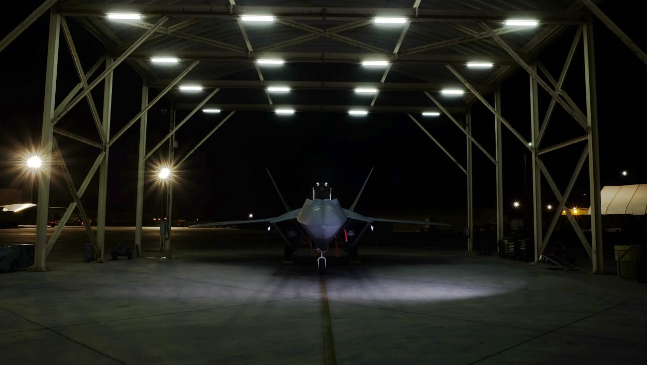 US Military Aircraft at Night Images - F-22A Raptor resting on the flight line