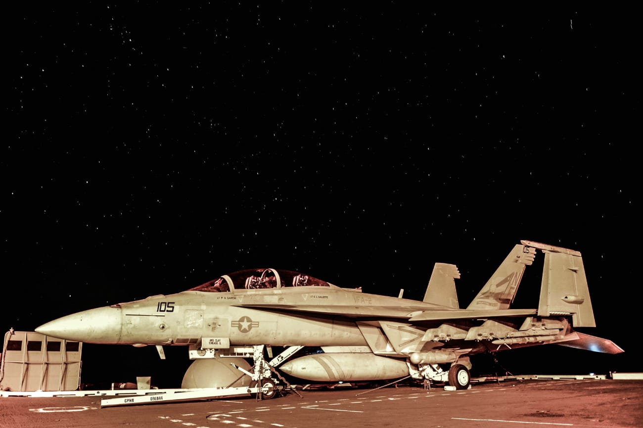 US Military Aircraft at Night Images - FA-18F Super Hornet sitting on the flight deck