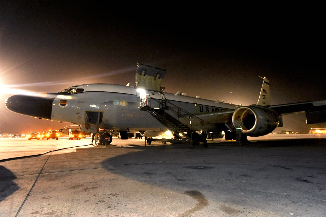 US Military Aircraft at Night Images - RC-135 Rivet Joint standing on the flight line
