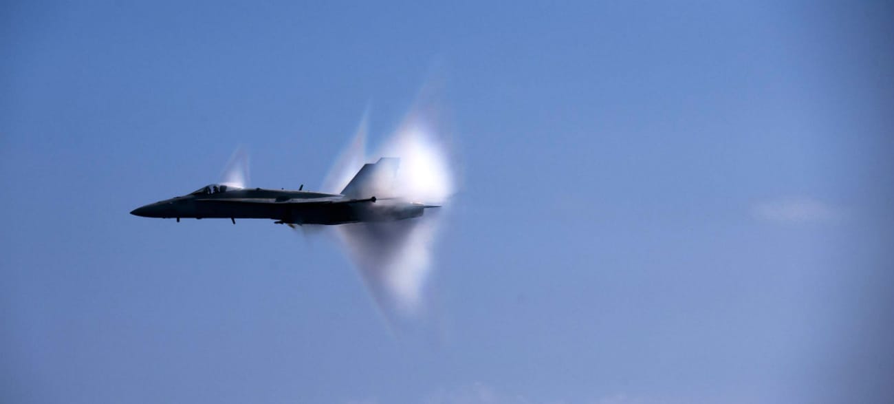 FA-18C Hornet breaking the sound barrier over the USS Carl VInson