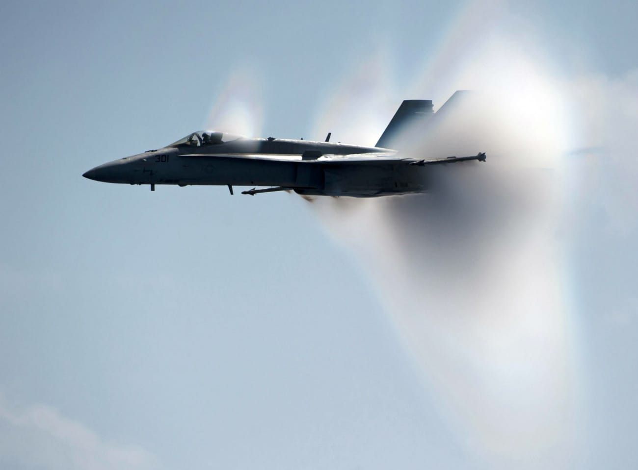 FA-18C Hornet breaks the sound barrier alongside the Nimitz-class aircraft carrier