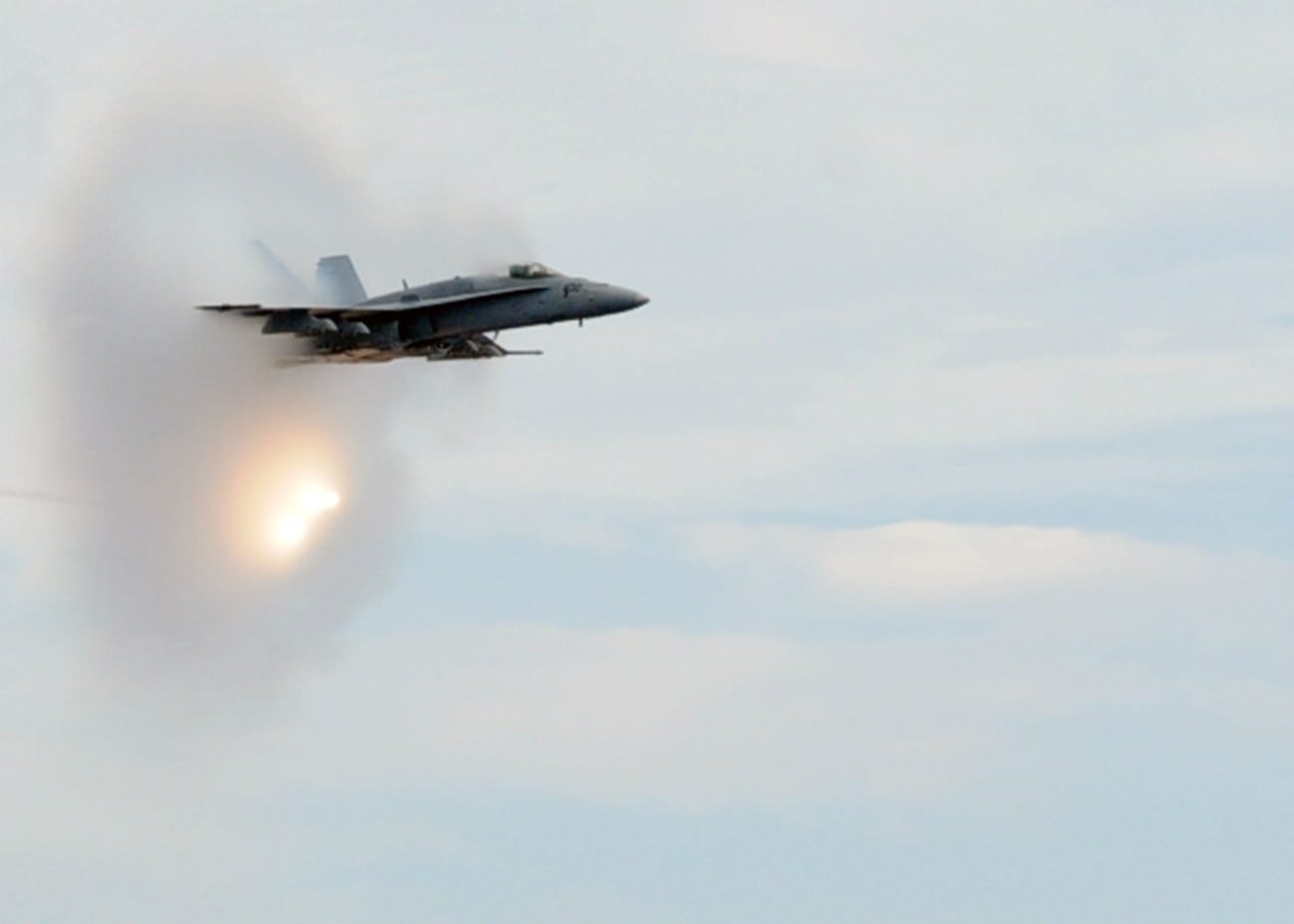 FA-18C Hornet dropping flares and breaking the sound barrier