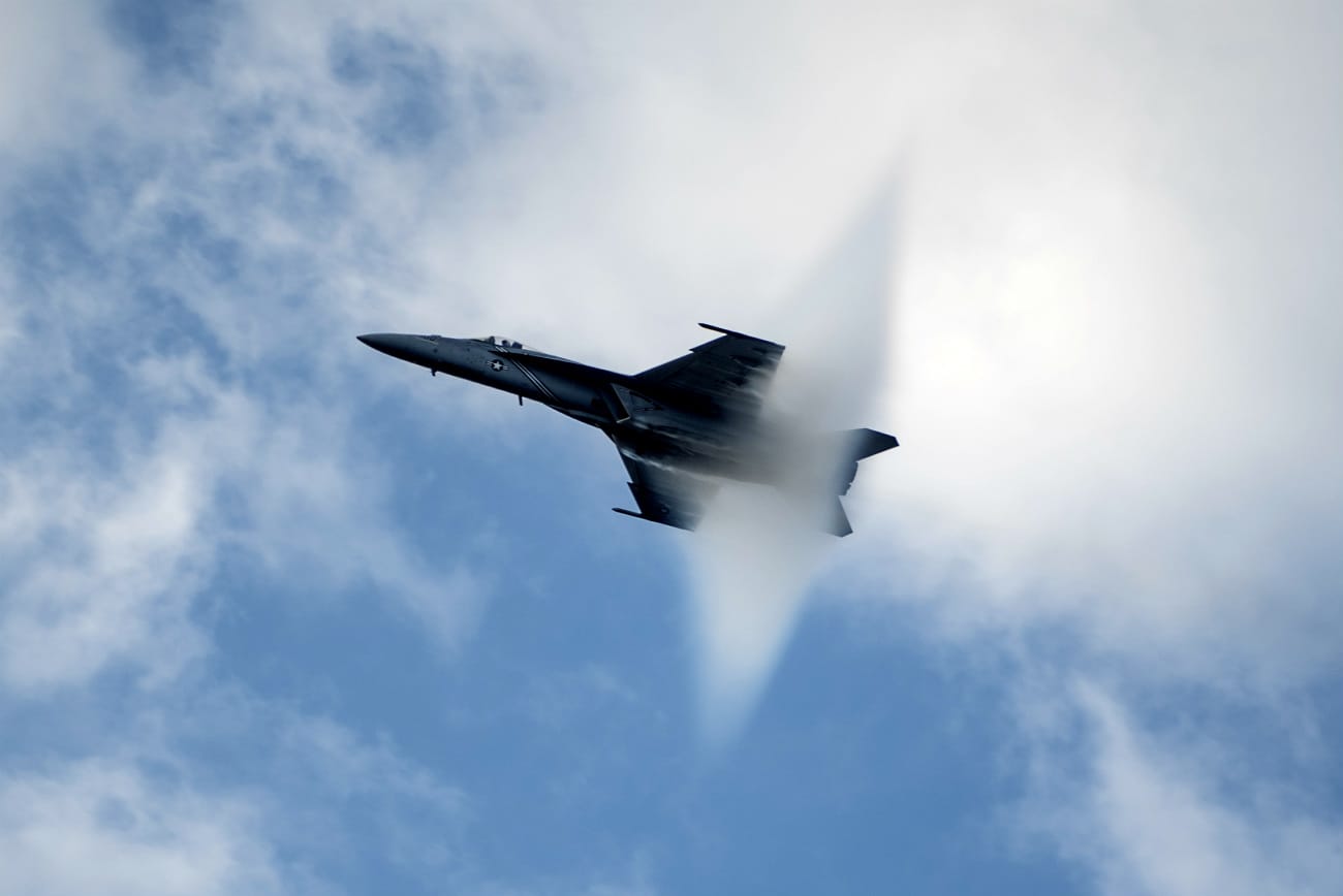 FA-18E Super Hornet above the USS Harry S. Truman