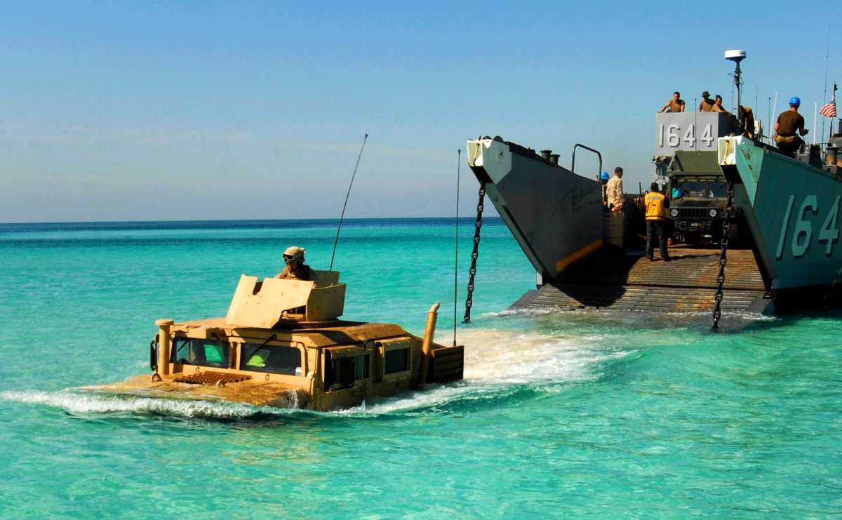 A Humvee launches from a landing craft utility assigned to amphibious dock landing ship USS Whidbey Island (LSD 41). Whidbey Island is deployed as part of the Bataan Amphibious Ready Group, supporting maritime security operations and theater security cooperation efforts in the U.S. 5th Fleet area of responsibility. 