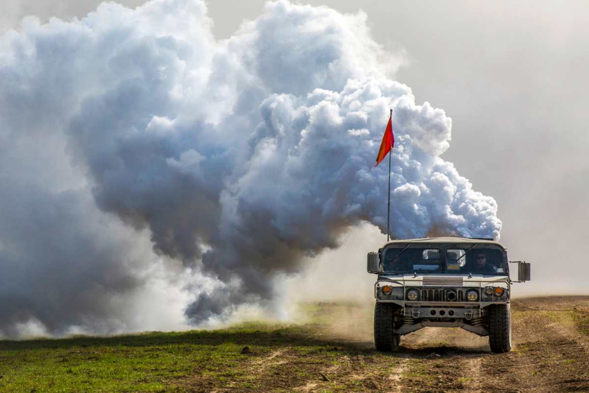 U.S. Soldiers assigned to 1st Battalion 63rd Armor Regiment, 2nd Armored Brigade Combat Team, 1st Infantry Division, operate a Humvee with a smoke generator during Combined Resolve X live fire exercise at Grafenwoehr, Germany, April 19, 2018. The Joint Warfighting Assessment (JWA) helps the Army evaluate emerging concepts, integrate new technologies, and promote interoperability within the Army, with other services, U.S. allies, and other coalition partners. JWA is the only exercise venue assessing 27 concepts and capabilities while aligning with U.S. Army Europe Readiness and other component exercises such as Combined Resolve X and Blue Flag 18 with a focus on a ready, interoperable Joint Force capable of accomplishing the mission and overmatching current and future enemies across the range of military operations.