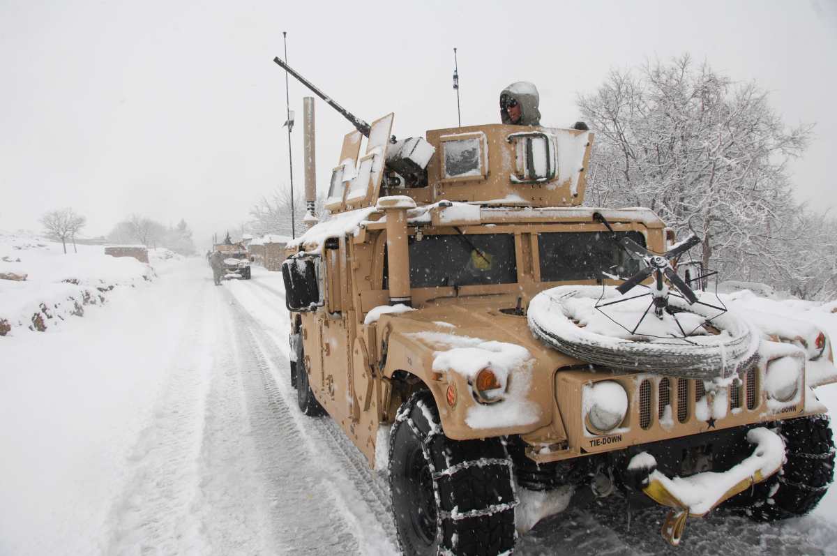 SGT Joseph Chmielewski from B Co., Division Special Troops Battalion, Task Force Gladius, Forward Operating Base Morales Frasier pulls security during a key leader engagement at Jalokheyl village on the main supply route Vermont, Tagab District, Kapisa Province, Afghanistan on February 5, 2008 